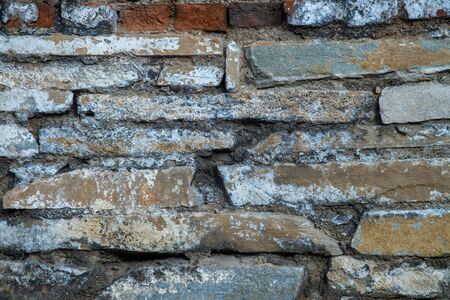 Old brick wall texture. Grunge background of aged stone surfaceの写真素材