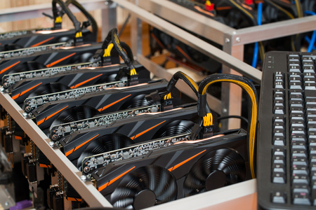 Graphics cards standing in a row in home mining farm. Close-up shot. Cryptocurrency industry.の写真素材