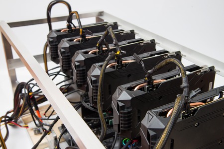 Graphics cards standing in a row in home mining farm. Close-up shot. Cryptocurrency industry.の写真素材
