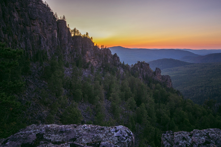 Beautiful landscape of sunset behind the mountains, Russia, Ural, Bashkortostan, Aygir, mountain range Karatash.の写真素材