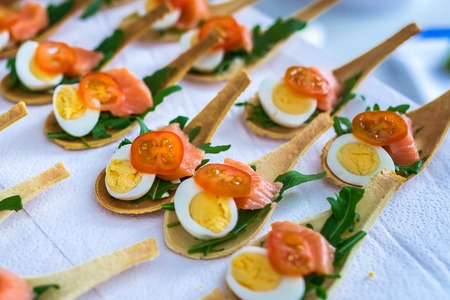 Delicates, appetizer filling with red fish and greens. Catring service.の写真素材