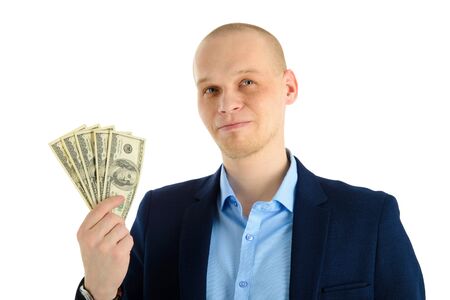 Thoughtful businessman in suit on white background holding cash. Thinking about making money.の写真素材