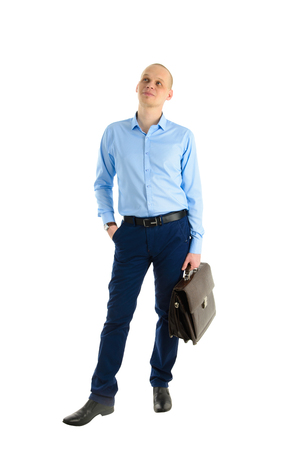 Handsome Caucasian businessman with briefcase standing standing full length portrait, isolated on white background.の写真素材