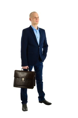 Portrait of businessman with briefcase in hands isolated on white background.の写真素材