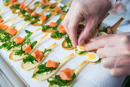 Delicates, appetizer filling with red fish and greens. Catering service.の写真素材