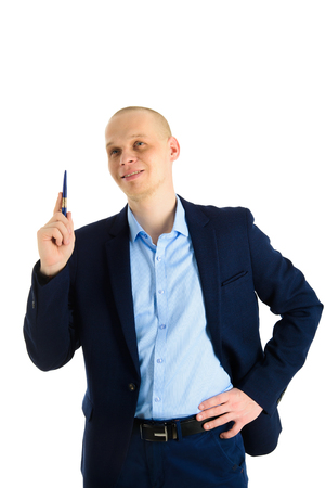 Happy Businessman using a pen, writing on invicible board, showing or presenting something. Isolated over white background.の写真素材