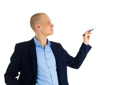 Portrait of Businessman using a pen, writing on invicible board, showing or presenting something. Isolated over white background.の写真素材