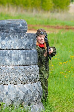 Izhevsk, Russia - June 2 2018: Young girl with a laser gun, playing lasertag shooting game, war simulation.のeditorial素材
