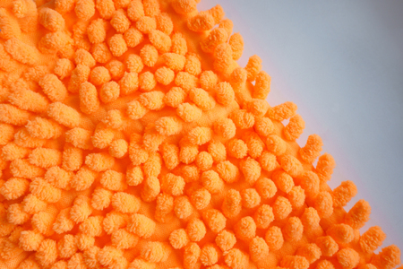 Orange color microfiber cleaning cloth material, closeupの写真素材