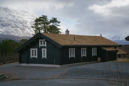 Norway - May 1, 2018: Norway countryside. Classic wooden houses near mountains, May 1, 2018.のeditorial素材