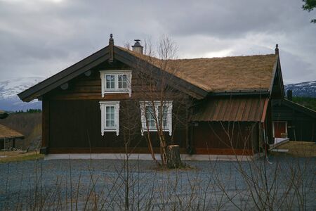 Norway - May 1, 2018: Norway countryside. Classic wooden houses near mountains, May 1, 2018.のeditorial素材