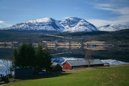 Norway beautiful spring landscape. Mountains reflection in calm water of fjord.の写真素材