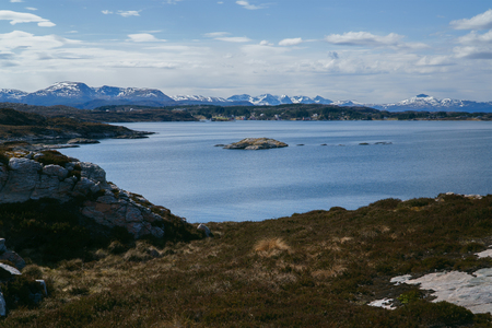 Rocky coast and Atlantic ocean, Beautiful landscape near Atlantic road in Norway in bright spring dayの写真素材