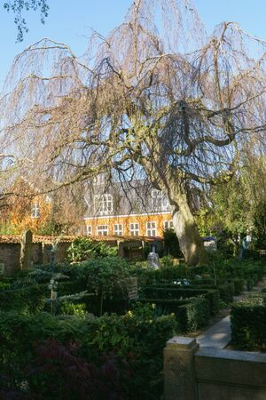 Denmark, Frederiksberg - May 6, 2018: Peaceful graveyard in spring sunny day, beautiful decorative gardening in cemetery.のeditorial素材