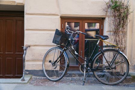 Copenhagen, Denmark- May 6, 2018: bicycle parked on city street near house.