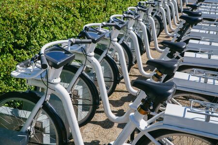 Copenhagen, Denmark- May 6, 2018: Many bicycles for rent parked on city street