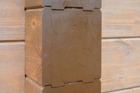 Wall texture of new wooden house painted with natural brown oil color.