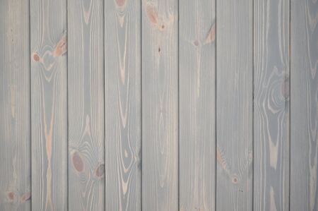 The unique texture of wooden wall made of planks colored with natural pastel paint, tiled backgroundの写真素材