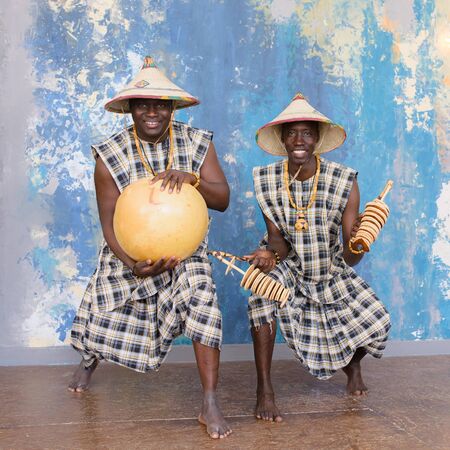 african drummers playing music on traditional musical instrumentsの写真素材
