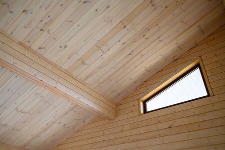 Interrior of new wooden house, walls and roof colored with natural paint .の写真素材