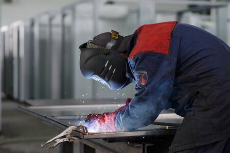 Welder working on factory, Welding Work. Erecting Technical Steel Industrial Craftsman on plantの写真素材