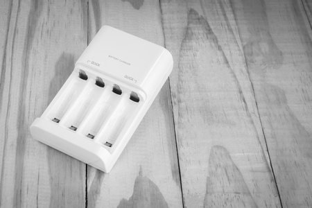 quick battery charger unit for charger on woodenの写真素材