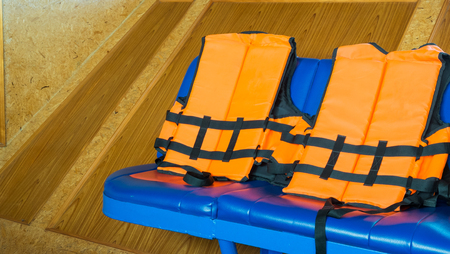 Life vests, Life jackets on the seat in the boatの写真素材