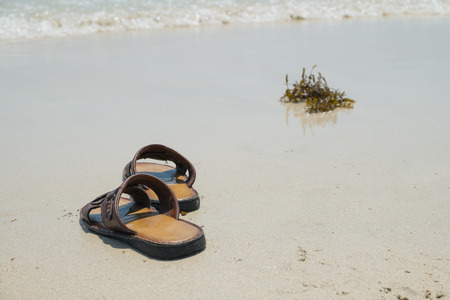 The memory, Abstract of memory , Abstract of leaving, Shoes on the beachの写真素材