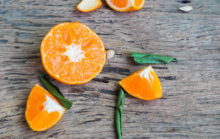 Fresh orange and leaf on wooden background, cross section orange on wooden, fiber aids digestion, Dietary fiberの写真素材