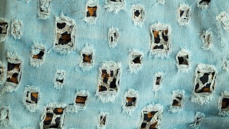 Art cut and paste tiger pattern on jeans, jeans texture background
