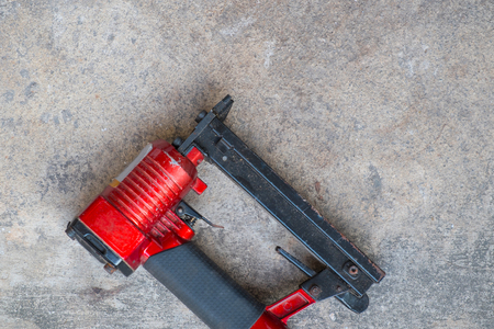 airgun on cement background, pneumatic staples on cement backgroundの写真素材