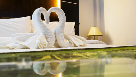 Towels decoration in bed room hotel, Swan shape の写真素材