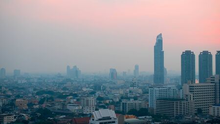 City and sky at twilight in bangkok, Thailand. Building in dark grey color