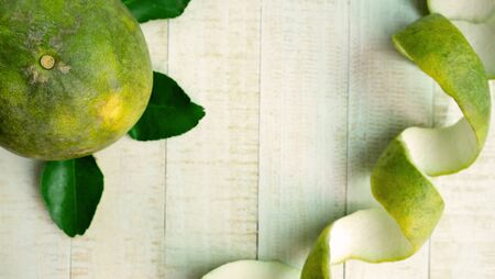 Fresh grapefruit and Grapefruit peel on wood, Orange peel look like cellulite in the womenの写真素材