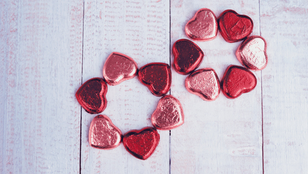 Valentine's day background, Love concept, Chocolate in foil on wooden  backgroundの写真素材