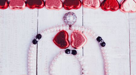 Valentine's day background, Love concept, two heart in pearl necklace on woodenの写真素材