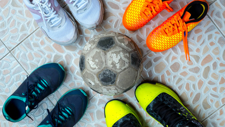 Symbol of Teamwork, Many shoes with ball on ground