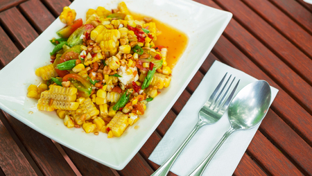 Spicy papaya salad with corn, salted eggsの写真素材