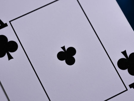 Casino theme. High contrast image of casino roulette, poker game, dice game, poker chips on a gaming table, all on colorful bokeh background. Place for typography and logoの写真素材