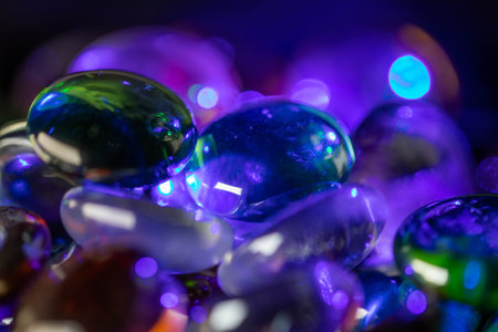 Colorful glass stones in colorful lightの写真素材