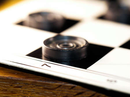 checkerboard with checkers. Game concept. Board game. Hobby. checkers on the playing field for a game.の写真素材