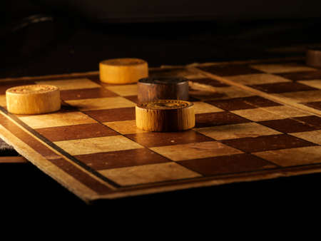 checkerboard with checkers. Game concept. Board game. Hobby. checkers on the playing field for a...