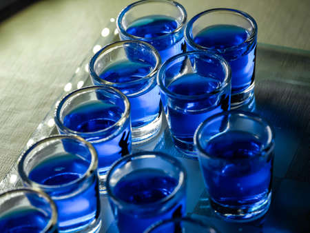 Chess board with shot glasses