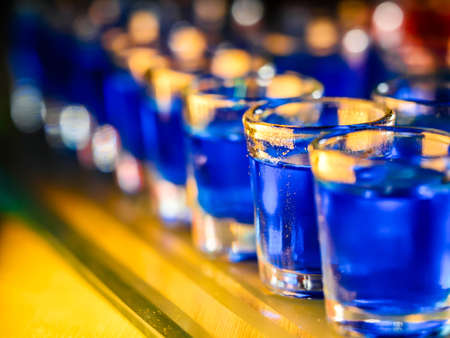 Chess board with shot glassesの写真素材