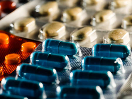 pharmaceuticals antibiotics pills medicine colorful antibacterials pills on white background capsule...