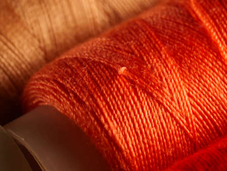 Sewing threads multicolored background closeup