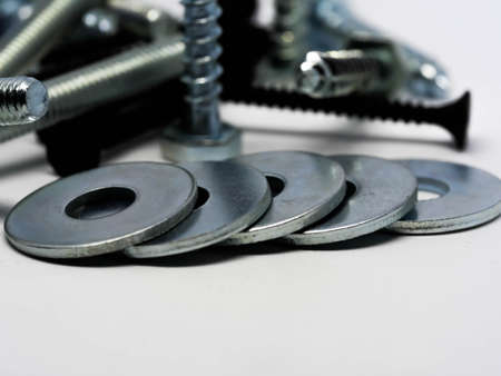 Close-up of various steel nuts and boltsの写真素材
