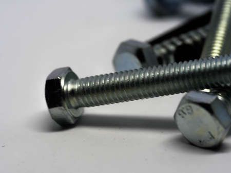 Close-up of various steel nuts and bolts