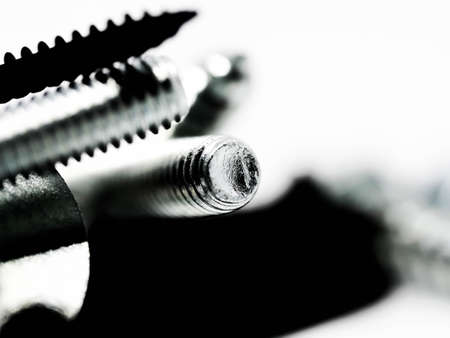 Close-up of various steel nuts and boltsの写真素材