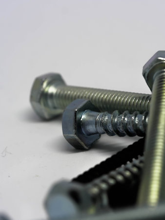 Close-up of various steel nuts and bolts